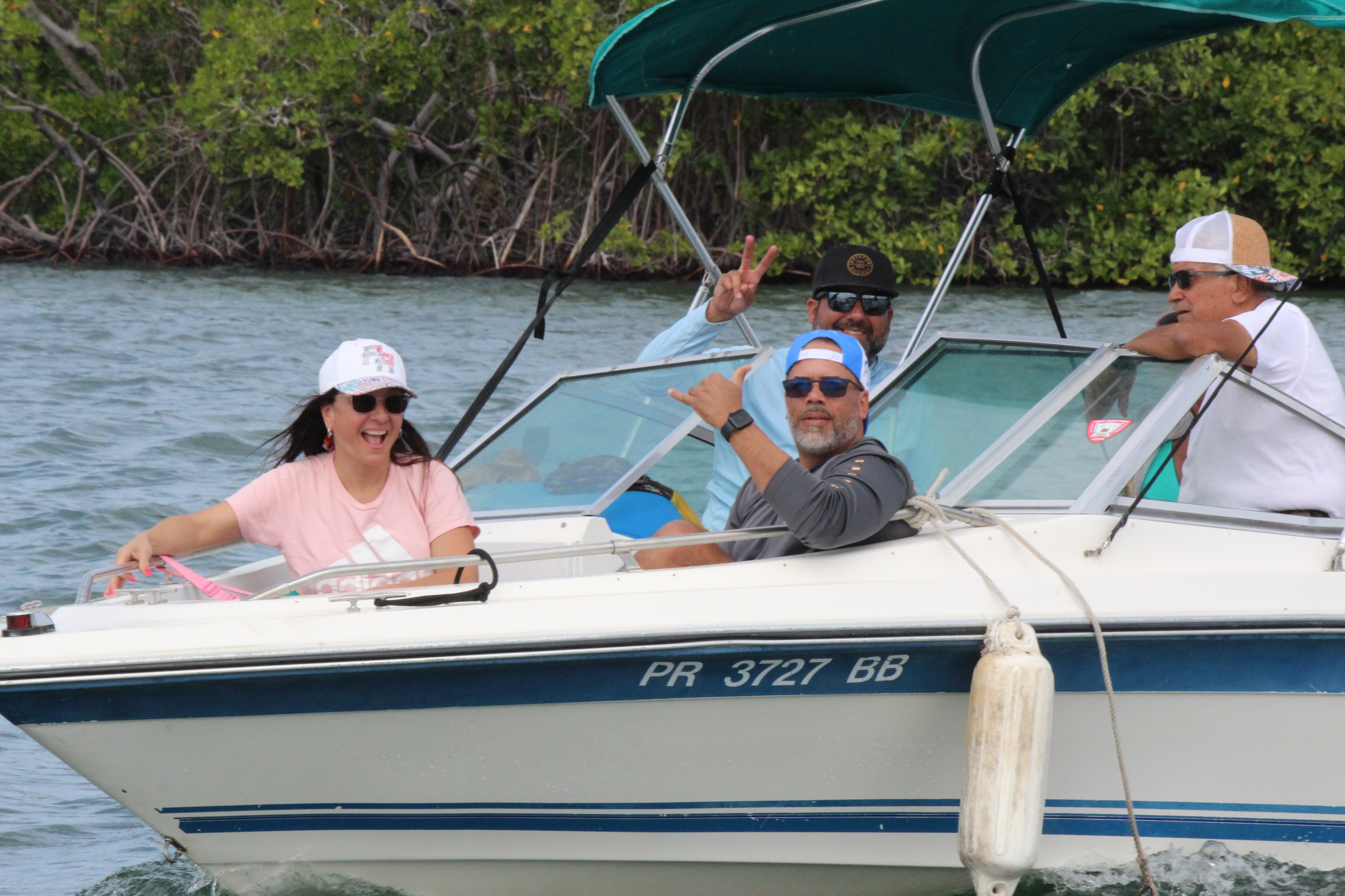 Family smiling on boat